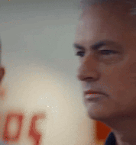 A Man 'S Face Is Shown In A Blurry Photo With The Number 50 In The Background GIF
