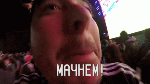 A Man 'S Face Is Shown With The Words " Mayhem " Written On His Face GIF