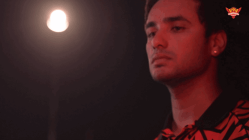 A Man 'S Finger Is Pointing At A Light That Says Wow On The Bottom GIF