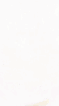 A Man 'S Head Is Shown In A Blurry Photo While Sitting At A Table GIF