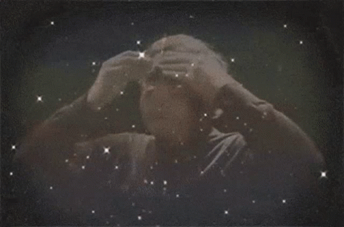 A Man 'S Head Is Surrounded By Lightning Bolts GIF