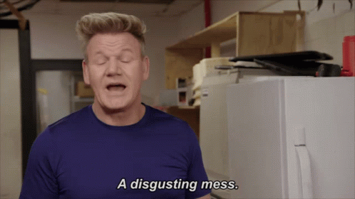 A Man Says A Disgusting Mess In Front Of A White Refrigerator GIF