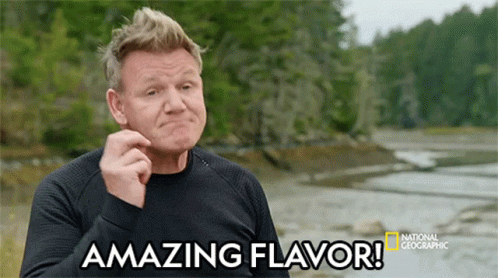 A Man Says Amazing Flavor In Front Of A Body Of Water GIF
