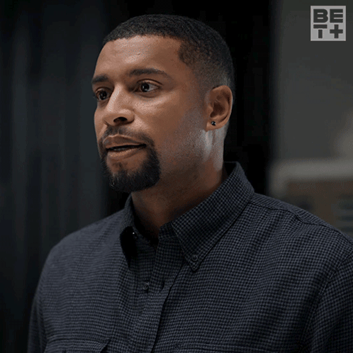 Man Saying Around Me Now Huh In Front Of Logo GIF