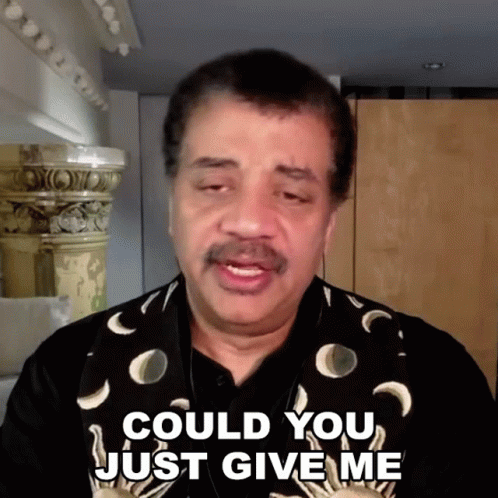 A Man Says Could You Just Give Me While Wearing A Vest With Crescent Moons On It GIF