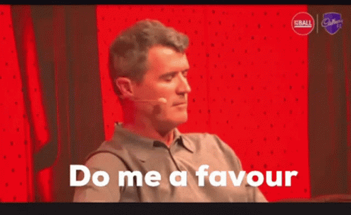 A Man Says Do Me A Favour In Front Of A Red Wall GIF