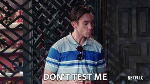 A Man Says " Do N't Test Me " In Front Of A Door GIF