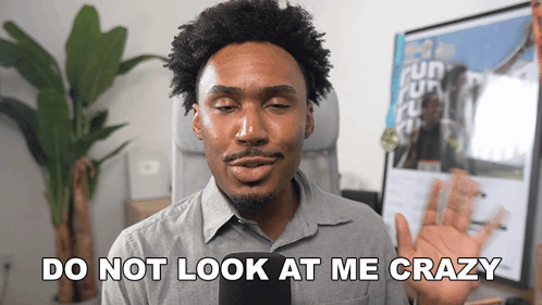 A Man Says " Do Not Look At Me Crazy " While Holding A Cell Phone GIF