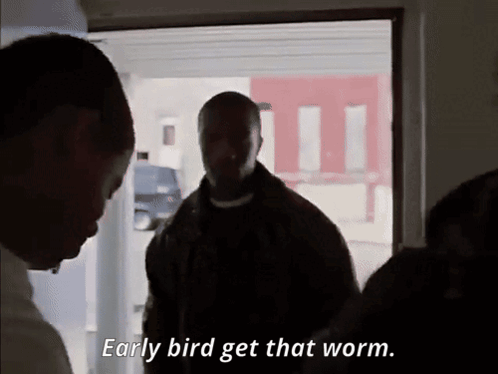 A Man Says Early Bird Get That Worm While Standing In A Doorway GIF