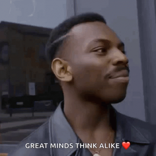 A Man Says Great Minds Think Alike And Has A Heart On His Chest GIF