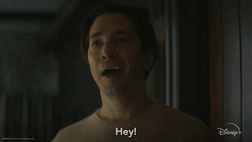 A Man Says Hey In A Disney + Advertisement GIF