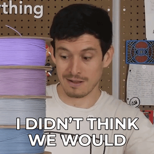 A Man Says " I Didn 'T Think We Would " In Front Of A Stack Of Spools Of Wire GIF