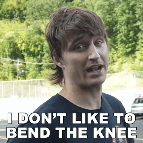 A Man Says " I Don 'T Like To Bend The Knee " While Wearing A Black Shirt GIF