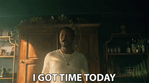 A Man Says I Got Time Today In Front Of A Wooden Cabinet GIF