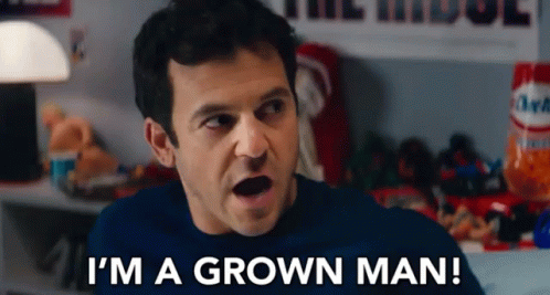A Man Says " I 'M A Grown Man " In Front Of A Table Full Of Snacks GIF