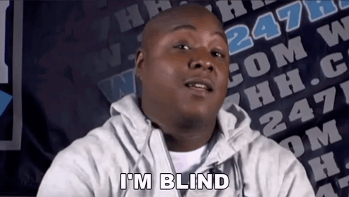 A Man Says I 'M Blind In Front Of A Banner With The Number 247 On It GIF