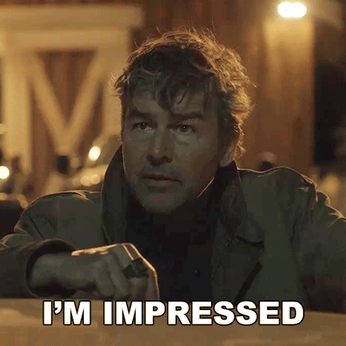 a man says i 'm impressed in front of a sign that says m