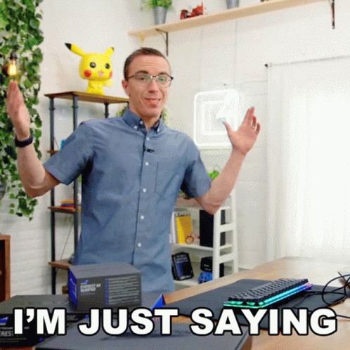 A Man Says I 'M Just Saying In Front Of A Desk GIF