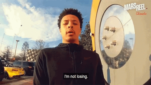 A Man Says I 'M Not Losing In Front Of A Mars Reel Clock GIF