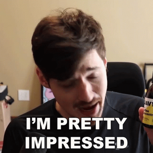 A Man Says I 'M Pretty Impressed While Holding A Bottle Of Navy Ale GIF