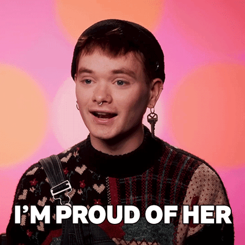 A Man Says I 'M Proud Of Her While Wearing A Sweater And Overalls GIF