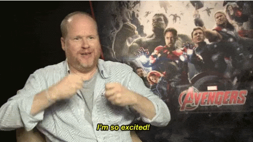 Man Excited In Front Of Avengers Poster GIF