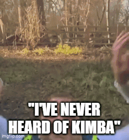 A Man Says " I 'Ve Never Heard Of Kimba " In Front Of A Fence GIF