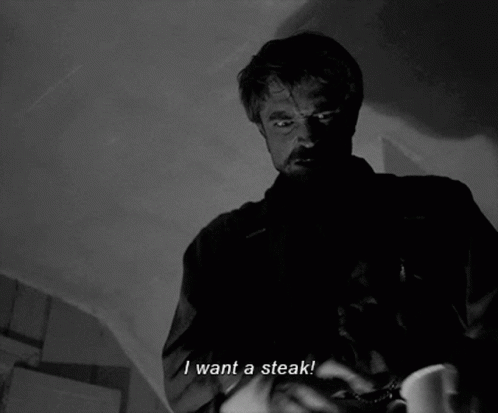 A Man Says I Want A Steak In A Black And White Scene GIF