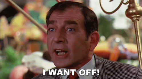 a man says " i want off " in front of a carousel