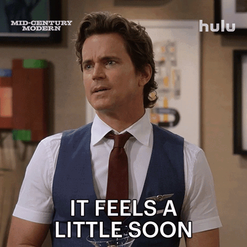 a man says it feels a little soon while wearing a suit and tie