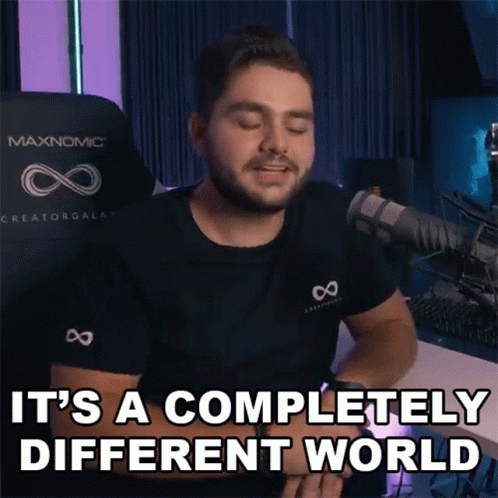 A Man Says It 'S A Completely Different World In Front Of A Microphone GIF