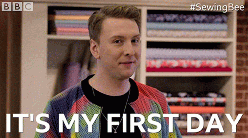 A Man Says It 'S My First Day In Front Of A Shelf Of Fabric GIF
