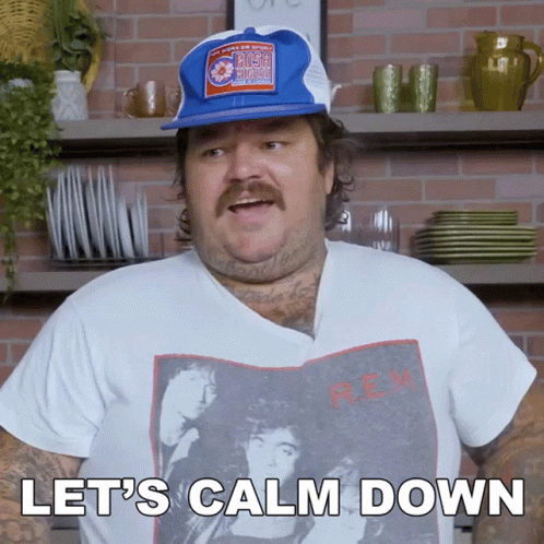 A Man Says Let 'S Calm Down While Wearing A Shirt That Says Rem GIF