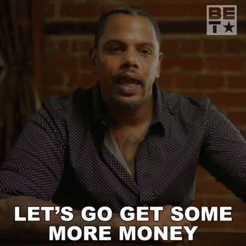 A Man Says Let 'S Go Get Some More Money While Sitting At A Table GIF