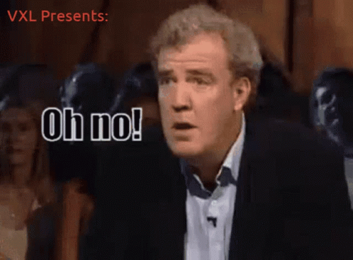 A Man Says Oh No In Front Of A Crowd Of People GIF
