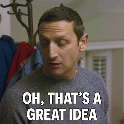A Man Says Oh That 'S A Great Idea In Front Of A Coat Rack GIF
