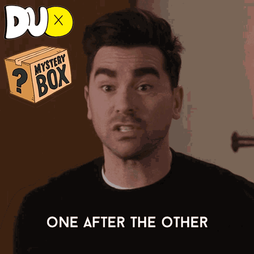 A Man Says One After The Other Next To A Box That Says Mystery Box GIF