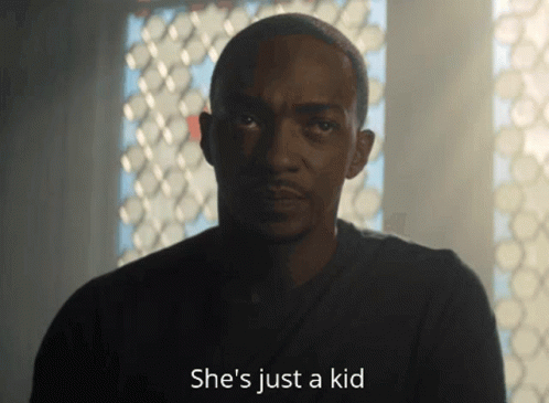 A Man Says She 'S Just A Kid And Looks At The Camera GIF