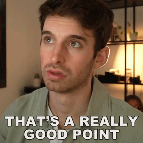 A Man Says That 'S A Really Good Point In Front Of A Shelf GIF