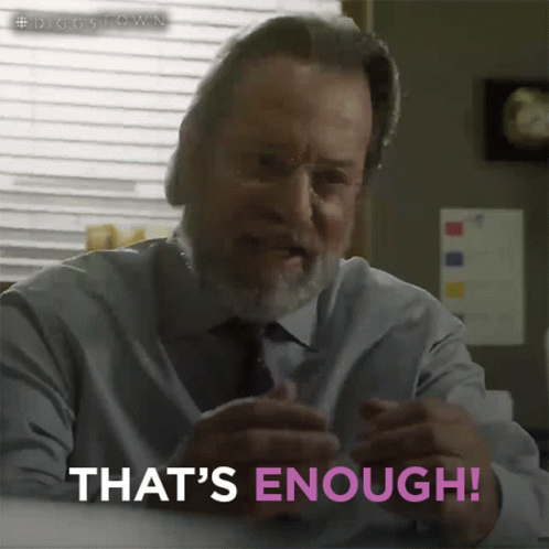 A Man Says That 'S Enough While Sitting At A Table GIF