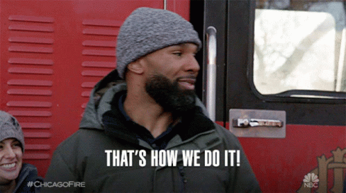 A Man Says That 'S How We Do It While Standing In Front Of A Fire Truck GIF