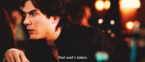 A Man Says " That Seat 'S Taken " In A Blurry Photo GIF