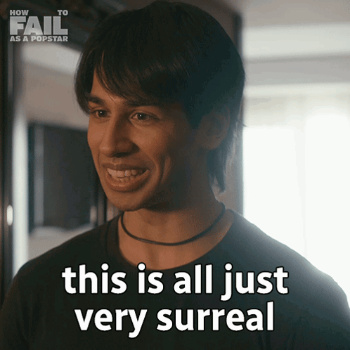 A Man Says " This Is All Just Very Surreal " In Front Of A Sign That Says How To Fail As A Popstar GIF