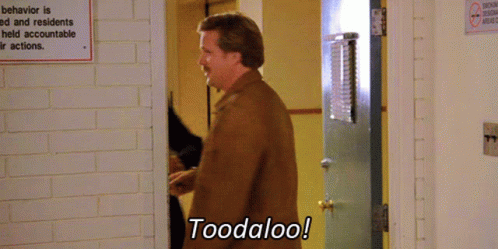 A Man Says Toodaloo In Front Of A Sign That Says Behavior Is Ed And Residents Held Accountable Their Actions GIF