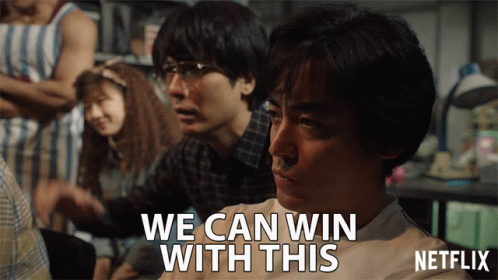 A Man Says We Can Win With This In Front Of A Group Of People GIF