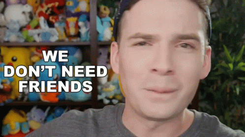 A Man Says We Don 'T Need Friends In Front Of A Stuffed Animal Shelf GIF