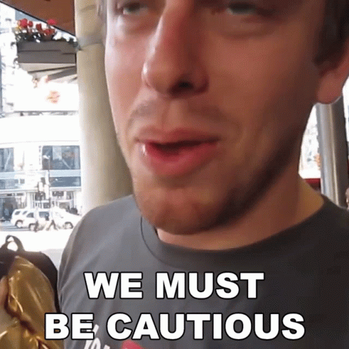 A Man Says We Must Be Cautious In Front Of His Face GIF