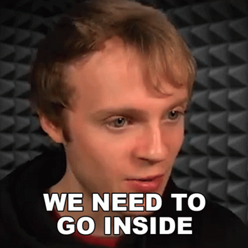 A Man Says " We Need To Go Inside " While Looking At The Camera GIF