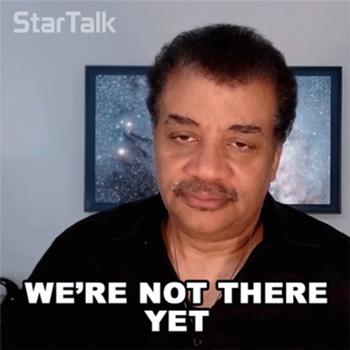 A Man Says " We 'Re Not There Yet " In Front Of A Framed Picture GIF