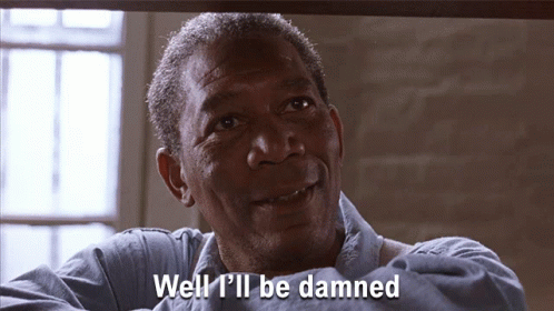 A Man Says " Well I 'Ll Be Damned " In A Prison Cell GIF
